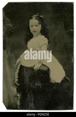 Circa 1860 tintype photograph, young girl aged 5-8 with tinted rosy cheeks. SOURCE: ORIGINAL TINTYPE IMAGE. Stock Photo