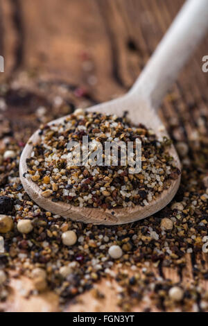 Wooden spoon with crushed Peppercorns (detailed close-up shot) Stock Photo