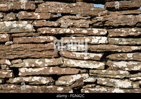 Background of an old weathered limestone wall outdoors Stock Photo