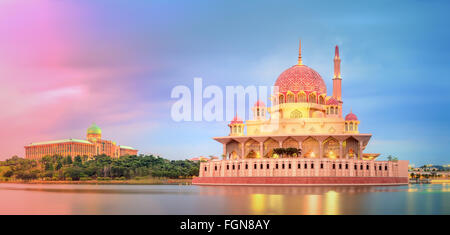 Sunset over Putrajaya Mosque and Panorama of Kuala Lumpur, Malaysia. Stock Photo