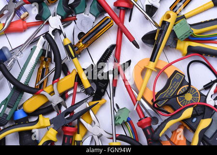 Tools to use in electrical installations on wooden background Stock Photo