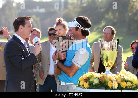 California, USA. 21st February, 2016. February 21, 2016 Bubba Watson picks up his daughter after she ran onto the green after winning the Northern Trust Open at Riviera Country Club in Pacific Palisades, California. Credit:  Cal Sport Media/Alamy Live News Stock Photo