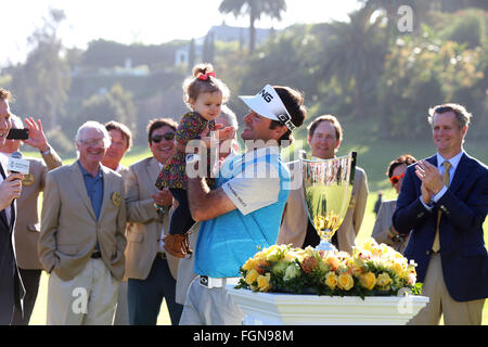 California, USA. 21st February, 2016. February 21, 2016 Bubba Watson picks up his daughter after she ran onto the green after winning the Northern Trust Open at Riviera Country Club in Pacific Palisades, California. Credit:  Cal Sport Media/Alamy Live News Stock Photo