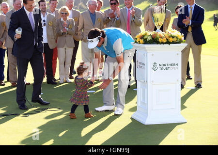 California, USA. 21st February, 2016. February 21, 2016 Bubba Watson picks up his daughter after she ran onto the green after winning the Northern Trust Open at Riviera Country Club in Pacific Palisades, California. Credit:  Cal Sport Media/Alamy Live News Stock Photo