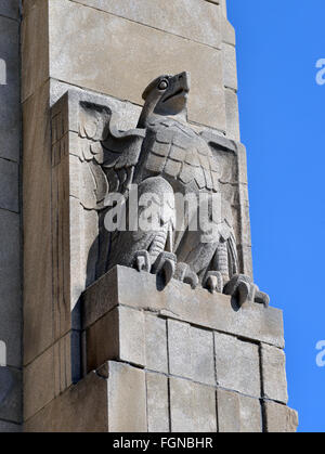 Art deco eagle face on old bank building Stock Photo