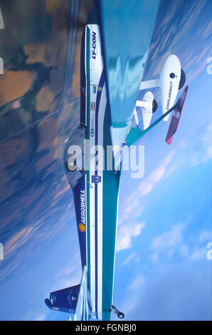 Aerobatic airplane in flight Stock Photo