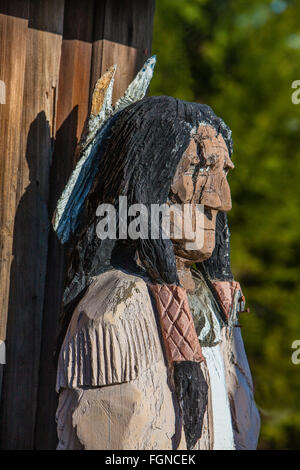 A wooden indian statue stands outside of a store in Los Olivos, California in the Santa Ynez Valley.