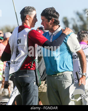 Los Angeles, California, USA. 21st Feb, 2016. Bubba Watson(R) of the United States celebrates with his caddie Ted Scott after winning the PGA Tour Northern Trust Open golf tournament at the Riviera Country Club in Pacific Palisades, California, United States on Feb. 21, 2016. Bubba Watson calimed the title for the second time in three years on Sunday. Credit:  Zhao Hanrong/Xinhua/Alamy Live News Stock Photo