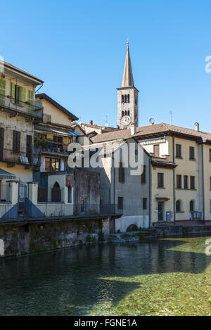 foreshortening of Omegna, between houses and the river with blue sky background - Piedmont, Italy Stock Photo