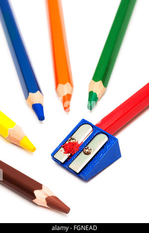 colored pencils and sharpener on a white background Stock Photo