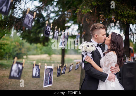 Bride and Groom at wedding Day walking in summer park Stock Photo