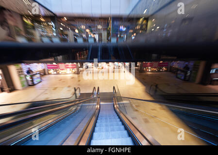 Shopping mall center escalators. Zoom blur movement Stock Photo - Alamy