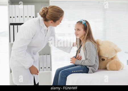 Doctor giving a patient a stuffed bear Stock Photo