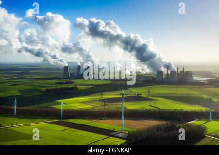 Neurath lignite power plant and Niederaußem power plant, RWE Power, vapor cloud, plume, emission, in front wind turbines Stock Photo