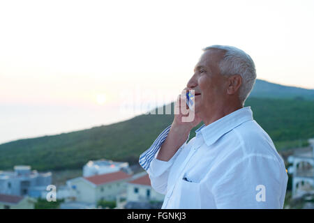 senior man using smart phone Stock Photo