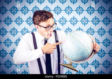 Composite image of geeky businessman pointing to globe Stock Photo