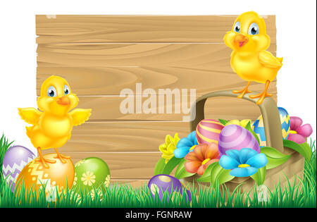 Isolated wooden cartoon Easter sign with Easter Chicks baby chicken birds, Easter Eggs, spring flowers and Easter basket in a fi Stock Photo