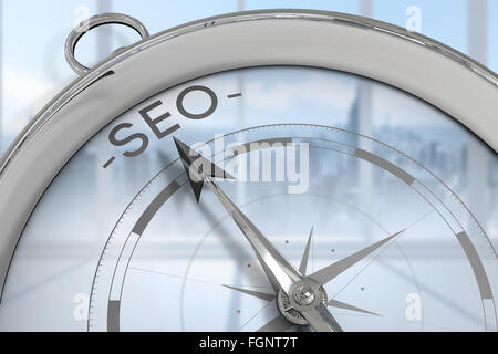 Composite image of compass pointing to seo Stock Photo