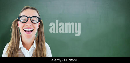 Composite image of female geeky hipster smiling at camera Stock Photo
