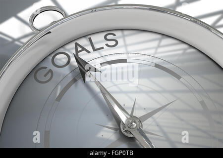 Composite image of compass pointing to goals Stock Photo