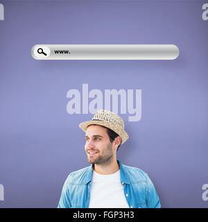 Composite image of handsome hipster wearing a trilby Stock Photo