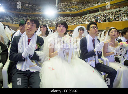 Unification Church's mass wedding, Feb 20, 2016 : Newlyweds participate in a mass wedding ceremony of the Unification Church at the Cheong Shim Peace World Center in Gapyeong, about 60 km (37 miles) east of Seoul, South Korea.The church said about 3,000 couples from more than 60 countries participated in the mass wedding in Gapyeong and other 12,000 couples attended in the wedding ceremony through live-streamed broadcast, which was organized by Han Hak-Ja, widow of the late Rev. Moon Sun-Myung, founder of the Unification Church. © Lee Jae-Won/AFLO/Alamy Live News Stock Photo