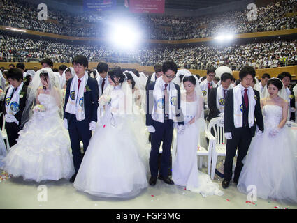 Unification Church's mass wedding, Feb 20, 2016 : Newlyweds participate in a mass wedding ceremony of the Unification Church at the Cheong Shim Peace World Center in Gapyeong, about 60 km (37 miles) east of Seoul, South Korea.The church said about 3,000 couples from more than 60 countries participated in the mass wedding in Gapyeong and other 12,000 couples attended in the wedding ceremony through live-streamed broadcast, which was organized by Han Hak-Ja, widow of the late Rev. Moon Sun-Myung, founder of the Unification Church. © Lee Jae-Won/AFLO/Alamy Live News Stock Photo