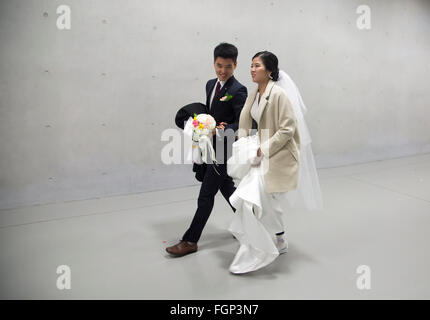 Unification Church's mass wedding, Feb 20, 2016 : Newlyweds walk after a mass wedding ceremony of the Unification Church at the Cheong Shim Peace World Center in Gapyeong, about 60 km (37 miles) east of Seoul, South Korea.The church said about 3,000 couples from more than 60 countries participated in the mass wedding in Gapyeong and other 12,000 couples attended in the wedding ceremony through live-streamed broadcast, which was organized by Han Hak-Ja, widow of the late Rev. Moon Sun-Myung, founder of the Unification Church. © Lee Jae-Won/AFLO/Alamy Live News Stock Photo