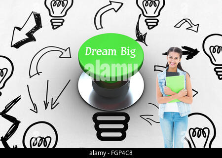 Dream big against digitally generated green push button Stock Photo