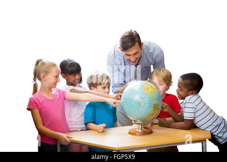 Composite image of cute pupils and teacher looking at globe in library Stock Photo