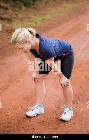Tired athletic blonde resting Stock Photo - Alamy