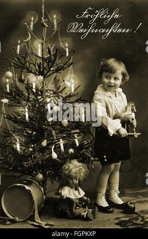Christmas, Christmas Eve, 'Merry Christmas', little girl with presents and Christmas tree, postcard, Germany, 1930, Additional-Rights-Clearences-Not Available Stock Photo