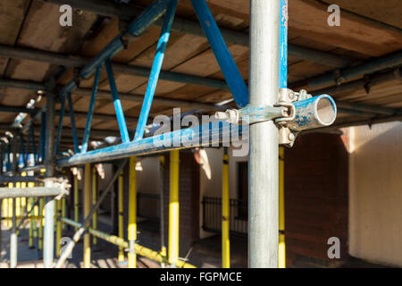 Close up of a scaffolding joint involving a scaffold beam, pole and coupler. England, UK Stock Photo