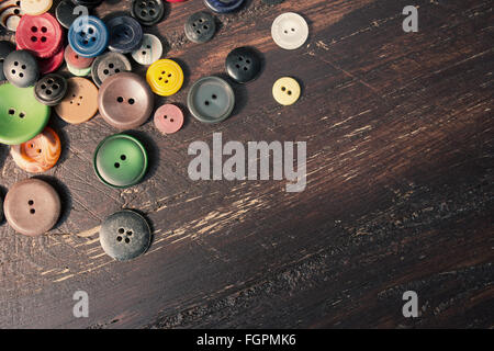 Set of vintage buttons on old wooden table Stock Photo