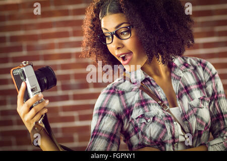 Attractive hipster taking selfies with camera Stock Photo - Alamy