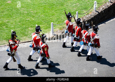 High angle viewpoint looking down on patrol of 19th century Redcoats of 1st regiment of Foot Guards, Marching away. Re-enactment at Dover castle. Stock Photo