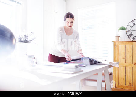 Interior designer browsing fabric swatches in office Stock Photo