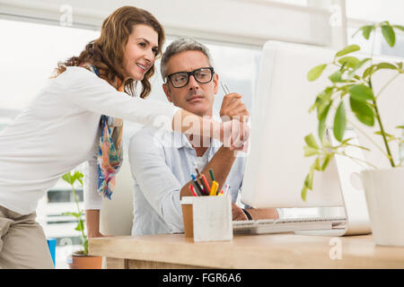 Two casual designers working with computer Stock Photo