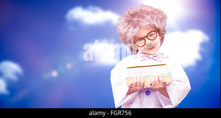 Composite image of dressed up pupil holding books Stock Photo