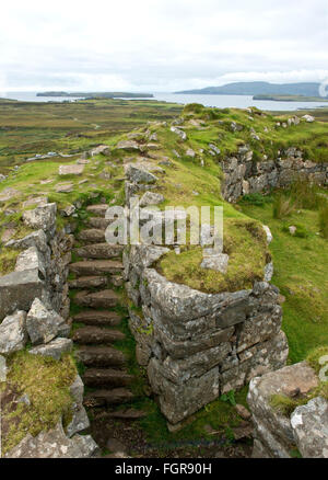 Ancient ruins of a Pictish Dun Beag broch round house on the Isle of Skye. Stock Photo