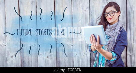 Future starts here against hipster using tablet pc Stock Photo