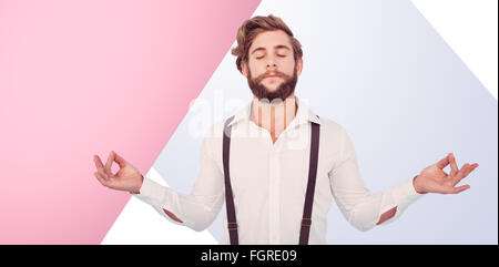 Composite image of hipster meditating arms outstretched Stock Photo