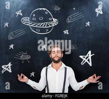 Composite image of hipster meditating arms outstretched Stock Photo