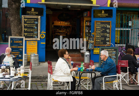Buenos Aires Argentina La Boca colorful restaurant with older couple having drink at the cafe Stock Photo