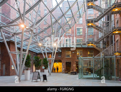 The atrium in the refurbished Royal Mills complex, Redhill Street, New Islington, Ancoats, Manchester, UK Stock Photo