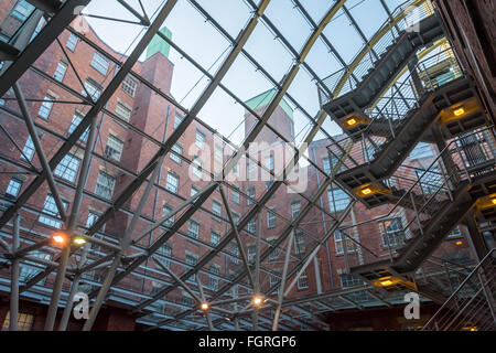 The atrium roof in the refurbished Royal Mills complex, Redhill Street, New Islington, Ancoats, Manchester, UK Stock Photo