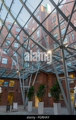 The atrium roof in the refurbished Royal Mills complex, Redhill Street, New Islington, Ancoats, Manchester, UK Stock Photo