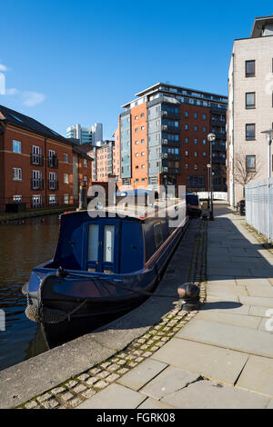 Narrowboat & apartment blocks at Paradise Wharf on the Ashton Canal near the city centre at Piccadilly, Manchester, England, UK Stock Photo