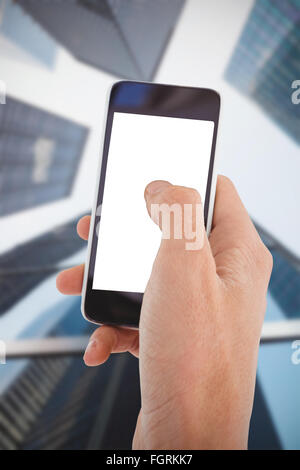 Composite image of cropped hand of man using mobile phone Stock Photo
