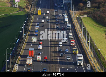 heavy traffic travelling on the m62 near moss moor huddersfield yorkshire uk Stock Photo